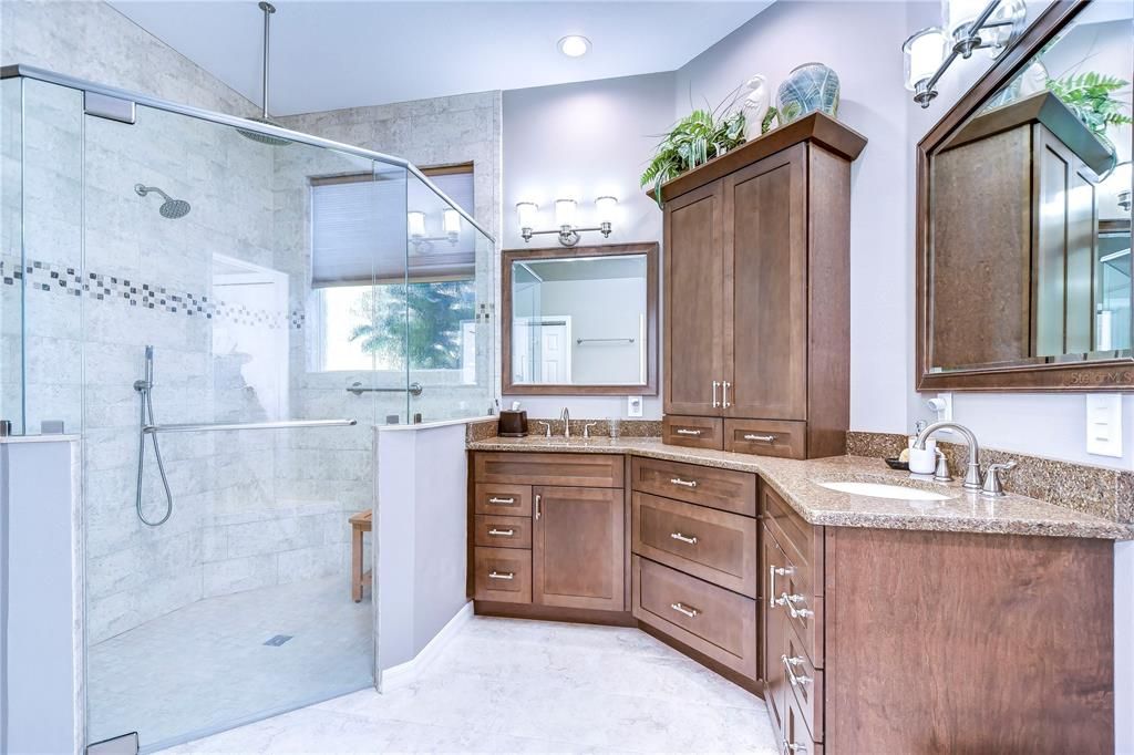 Huge walk-in shower and a dual sink vanity with added storage!