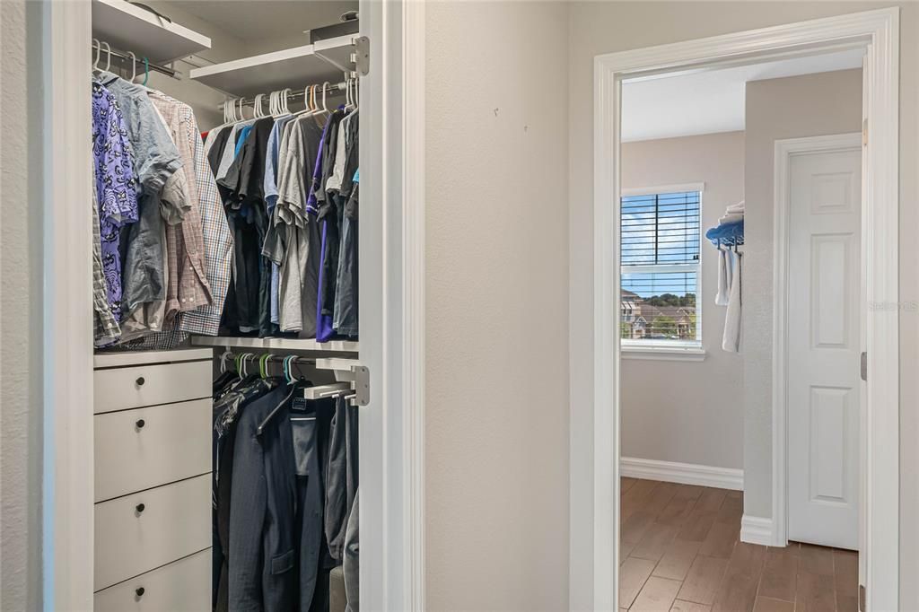 Dual owners closets outfitted with built in organization