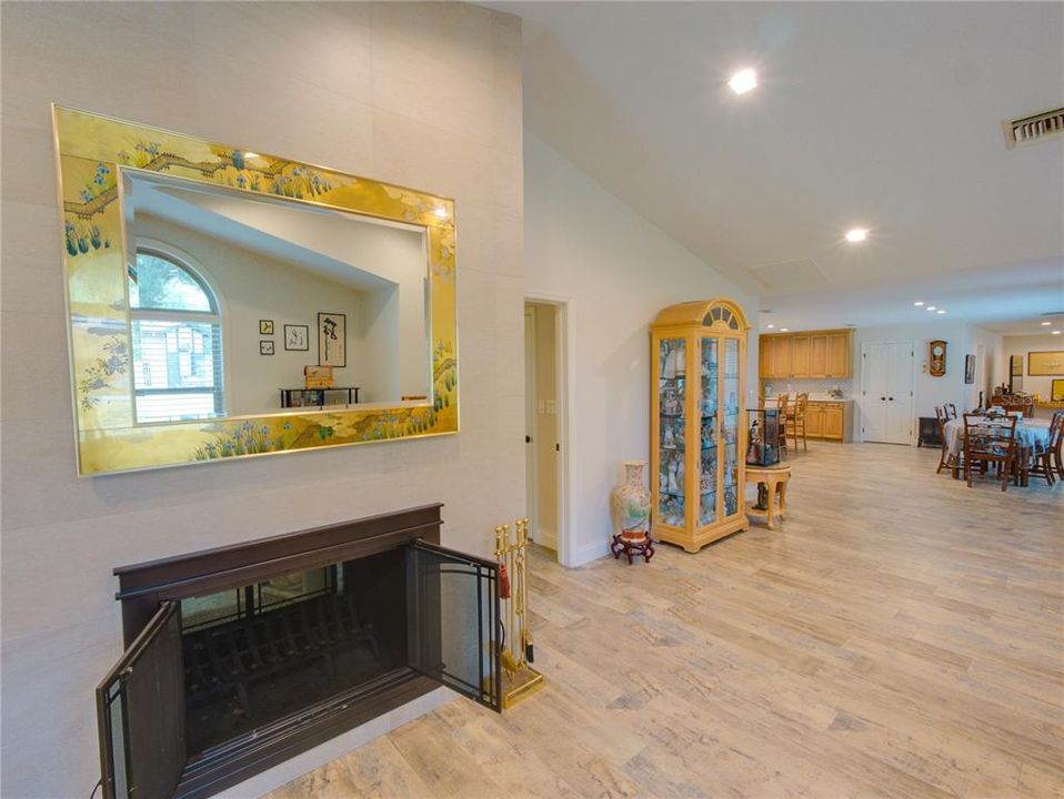 Family room with fireplace and cathedral ceilings