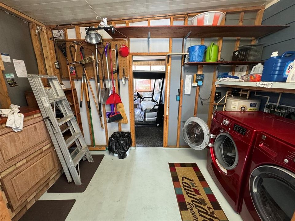 Laundry Room & Storage with direct access to Golf Cart Garage.