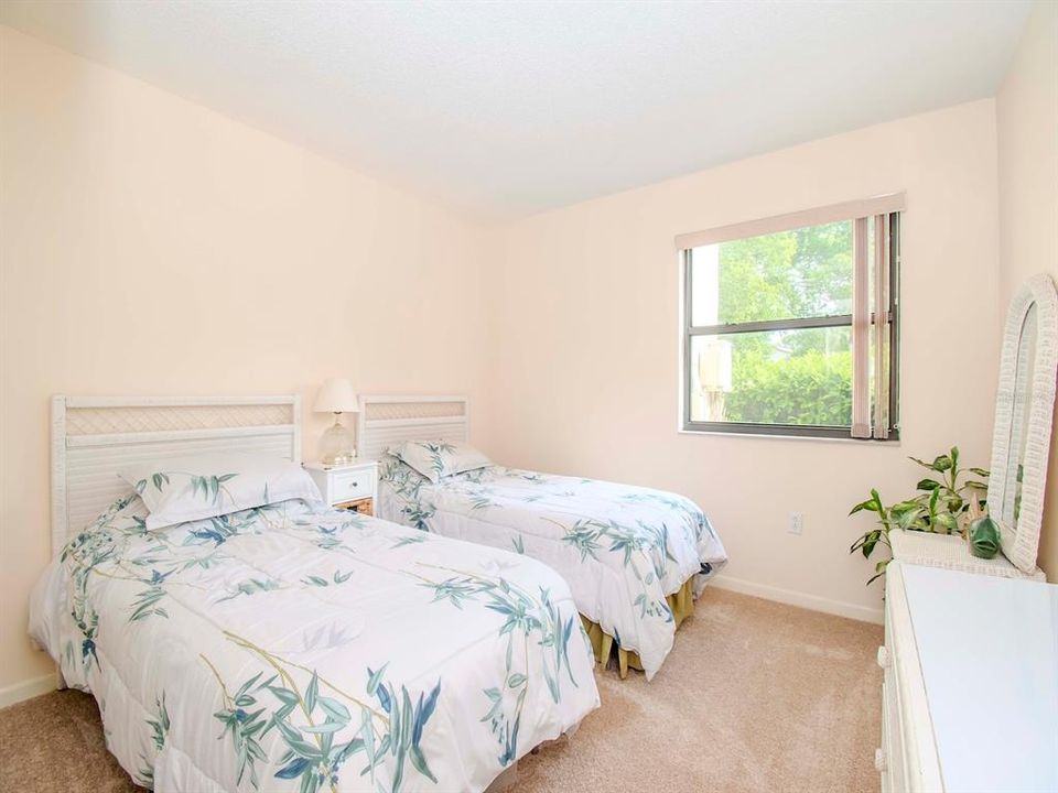 Guest bedroom is large enough for two twins or a queen-size bed