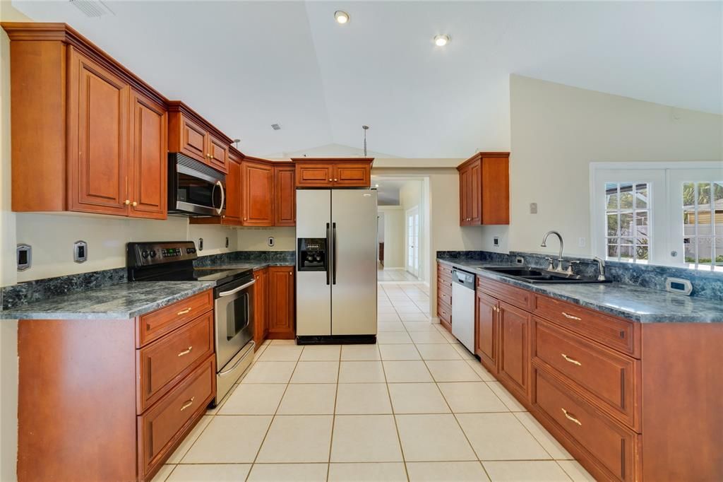 Perfectly situated in the heart of this home the kitchen offers the home chef a comfortable layout, STAINLESS STEEL APPLIANCES, a walk-in pantry for ample storage and breakfast bar for casual dining or entertaining!