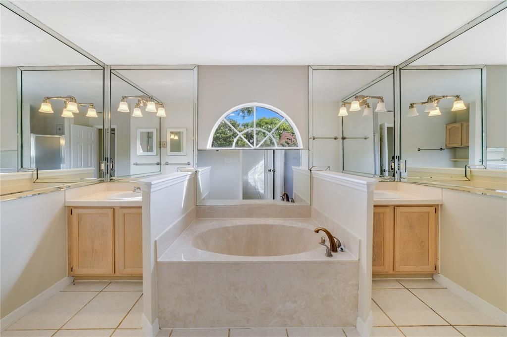 Your en-suite bath is another bright space with split vanities, a soaking tub and separate shower!