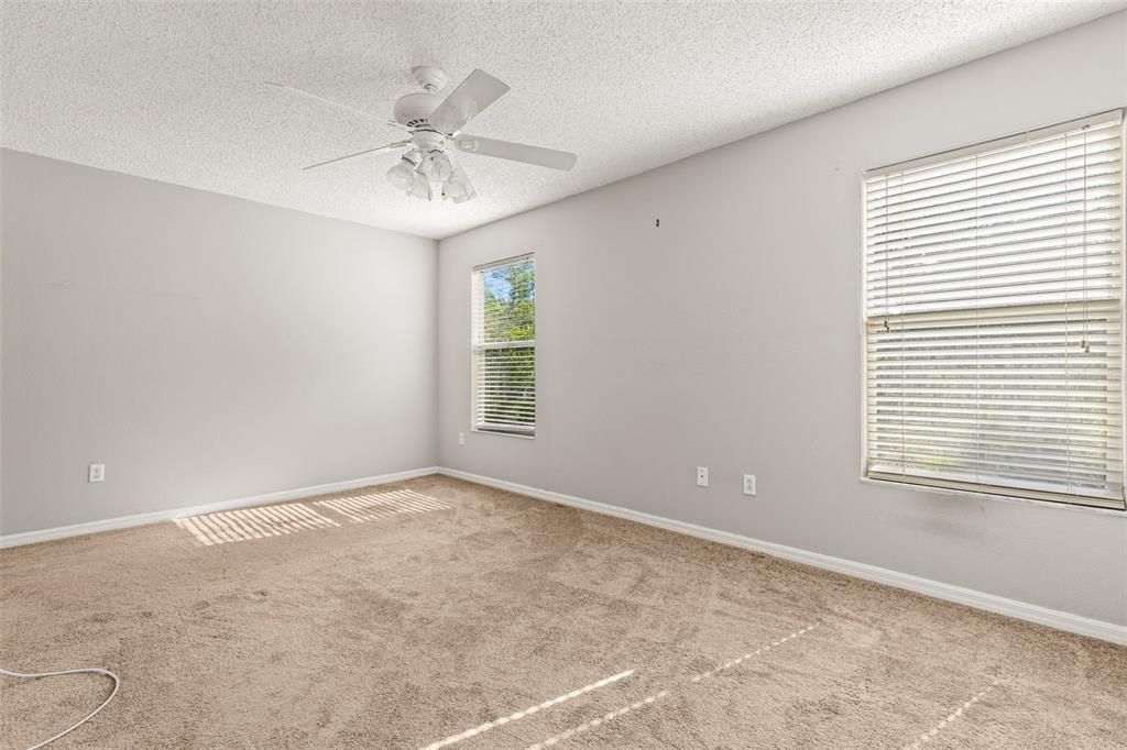 primary bedroom with pond view