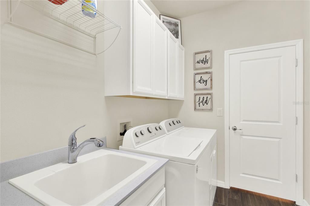 Laundry Room with Laundry sink and cabinets