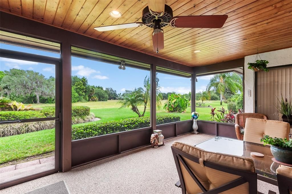 SCREENED LANAI WITH VIEW TOWARDS GREENSPACE