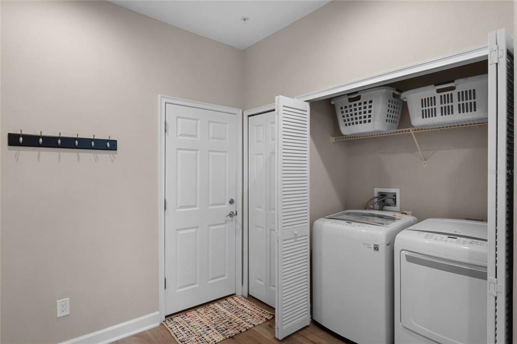 Foyer with Laundry Closet and Garage Entrance