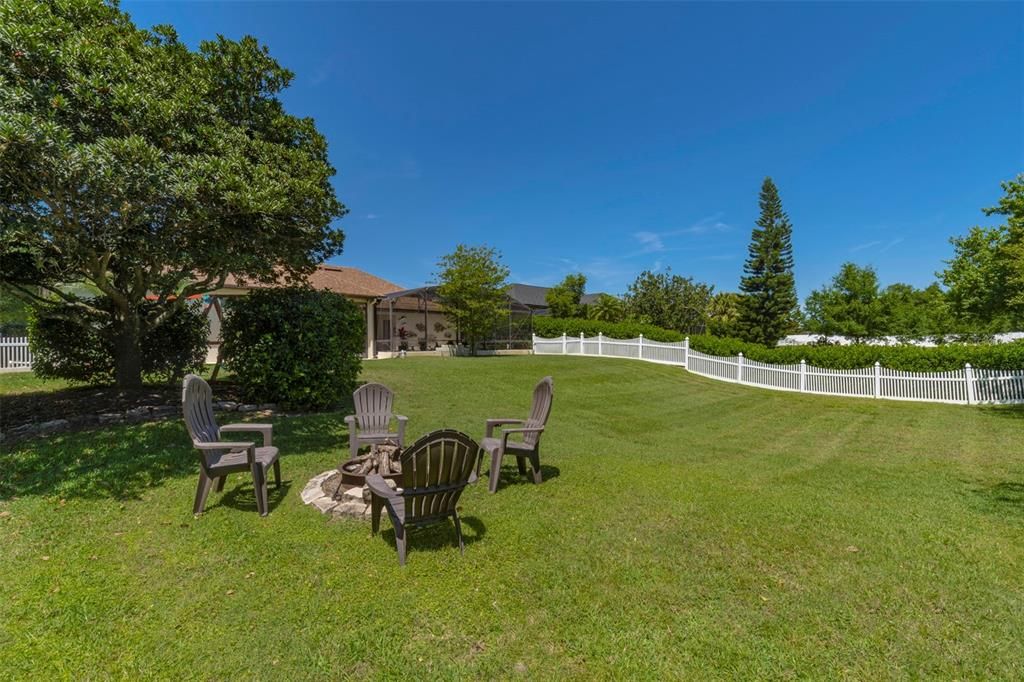 Backyard from fire pit corner of property