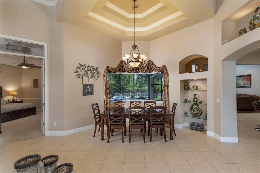 Dining room with pool beyond