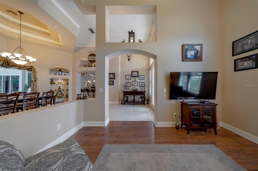 Living room with foyer and dining room beyond