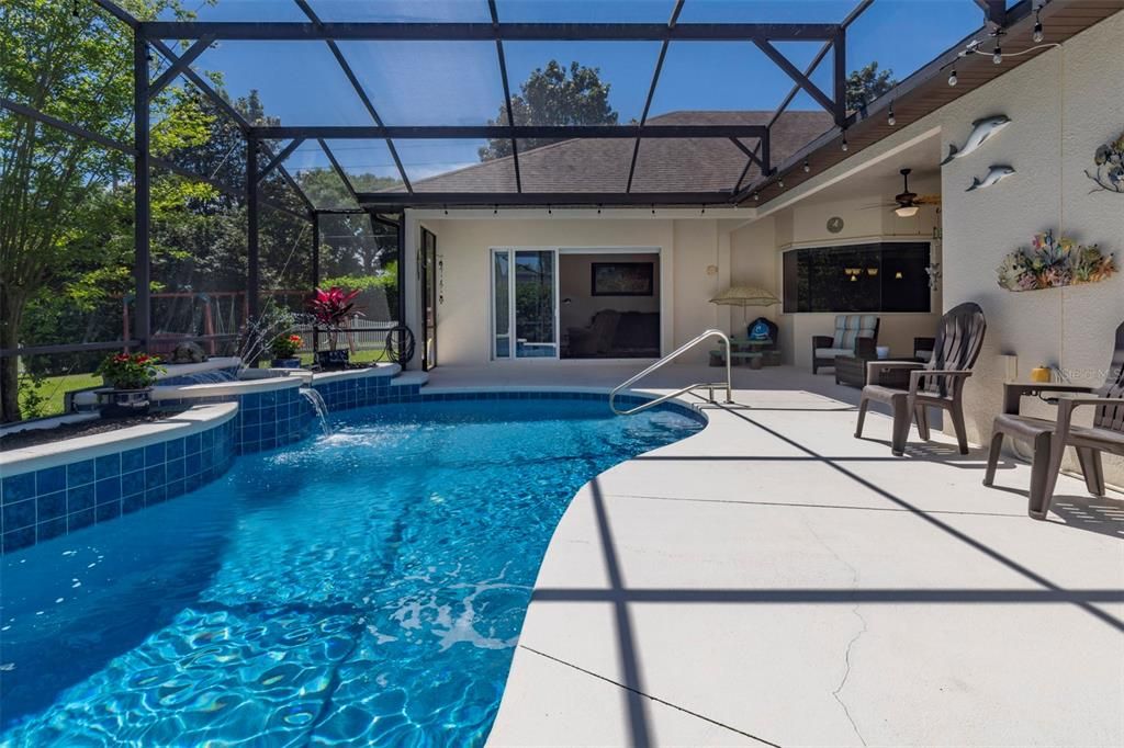 Pool lanai with triple stacking slider to family room