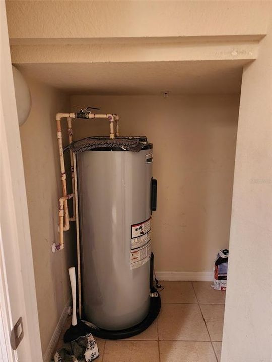 Water heater in storage closet.