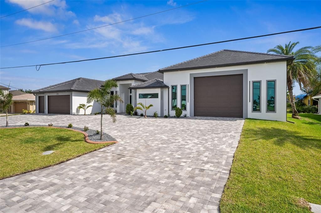 Stunning front with view of RV Garage