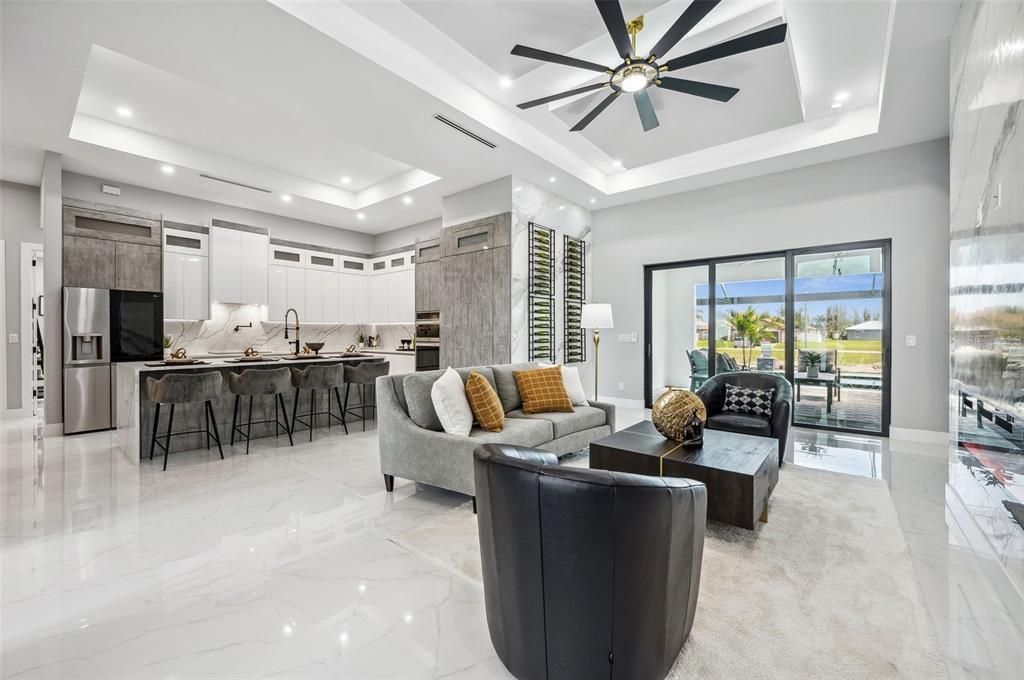 Entry and living room with kitchen beyond