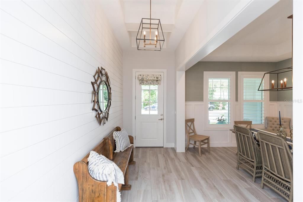 Entry with beautiful millwork and shiplap
