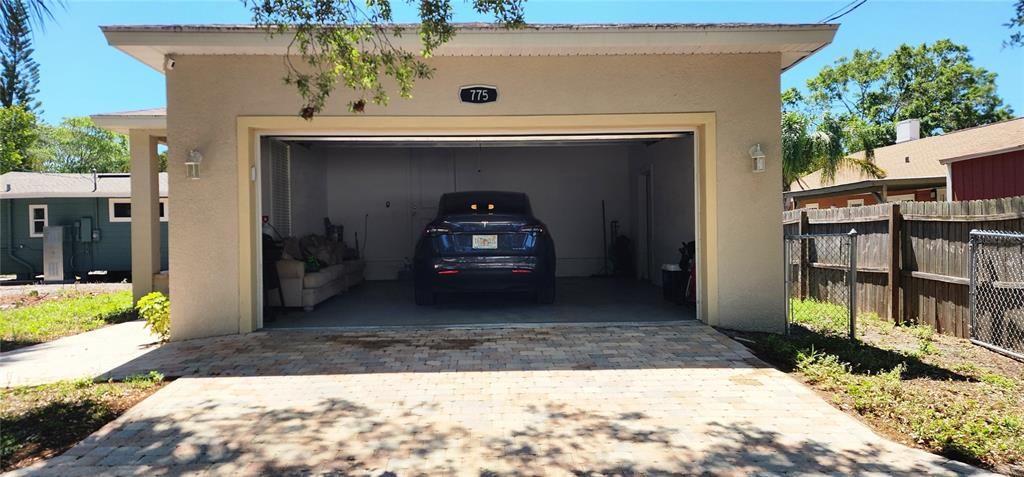 two car garage with side door access to dog run area.