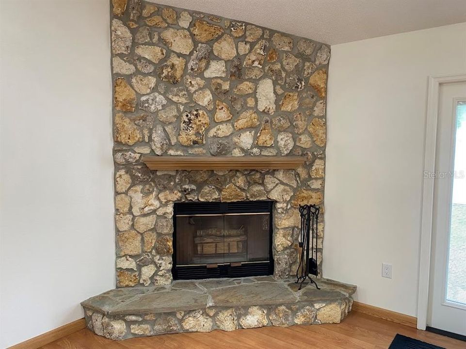Stone woodburning fireplace