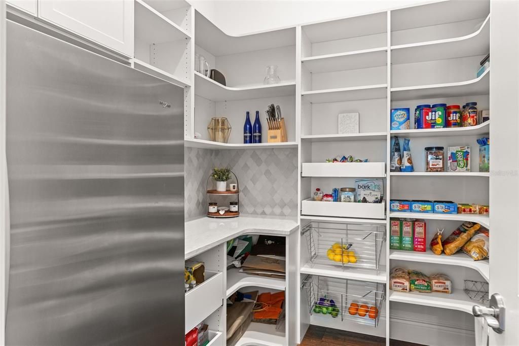 Walk in Pantry with extra refrigerator.