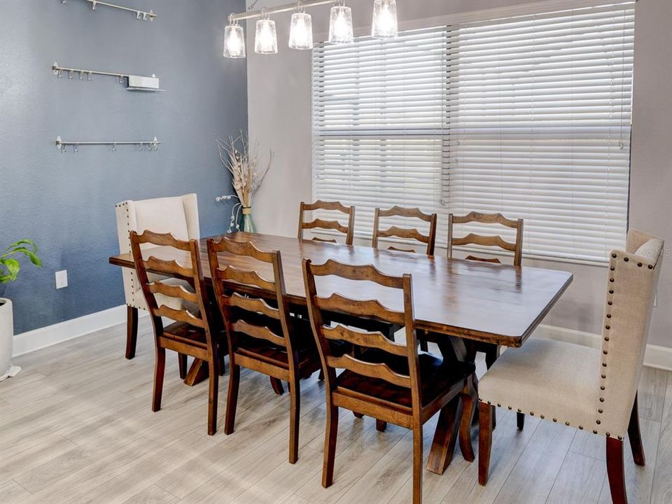Dining room table with 8 chairs that will stay with the home.