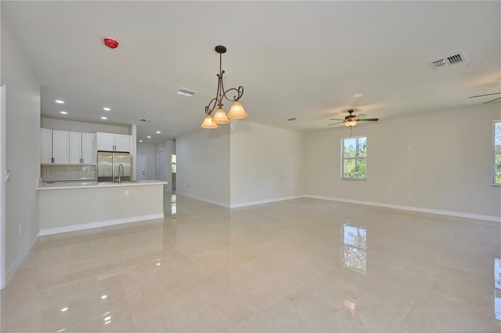 Reverse view looking back from dining area.  Doorway to right leads into secondary bedrooms and guest bathroom.