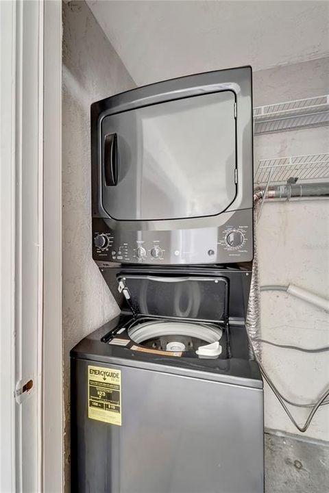 Washer and dryer. Utility closet within unit.