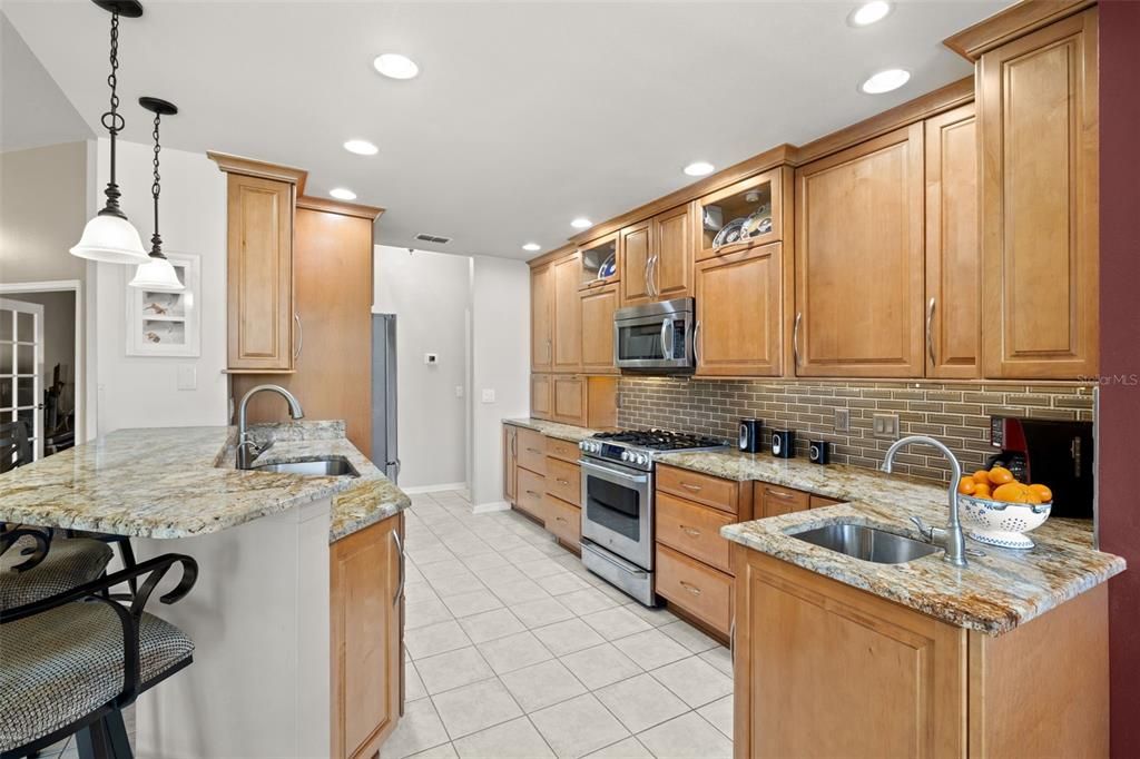 Custom Kitchen with hardwood cabinets, granite and stainless appliances