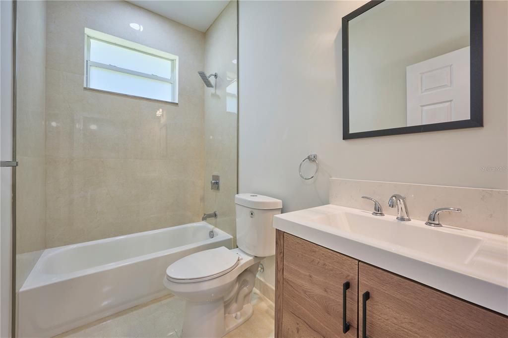 Guest bathroom located between the two secondary bedrooms
