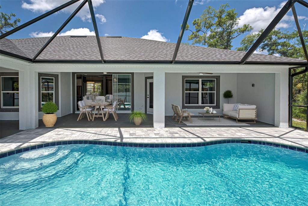 Virtually staged.  You will spend all of your time enjoying the wonderful Florida weather in your private lanai and pool.  Tremendous value:  home is already plumbed and ready for your outdoor kitchen.