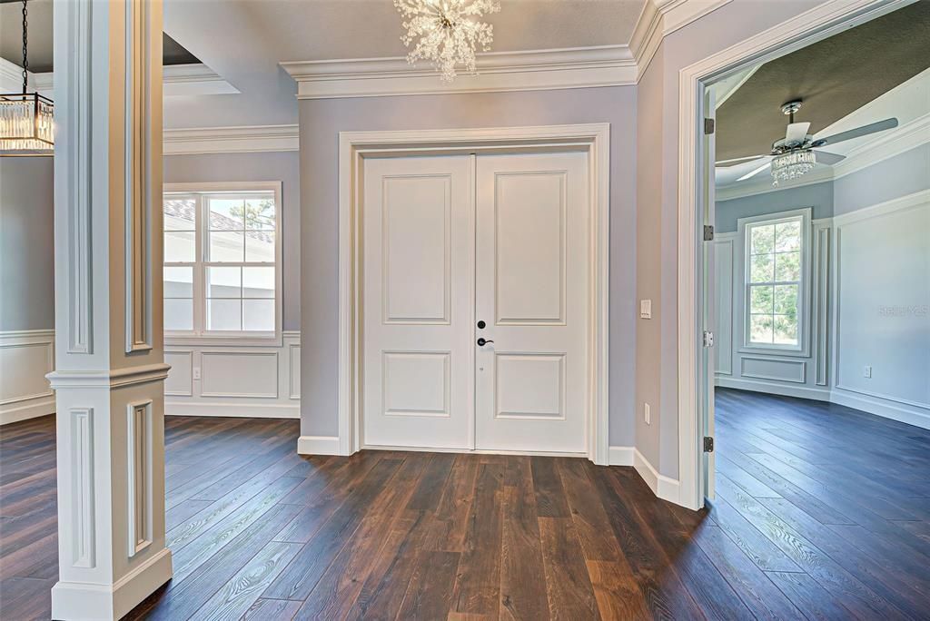 Welcoming double doors, beautiful lighting and luxury, water proof vinyl plank flooring greet you.