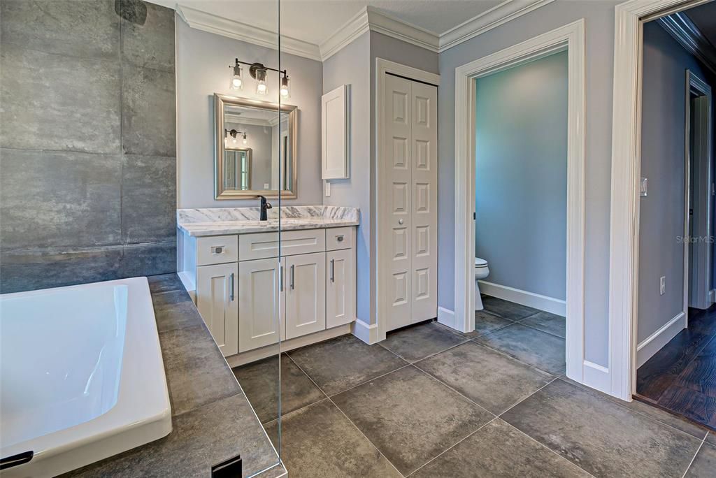 Primary suite also offers a linen closet and private water closet.