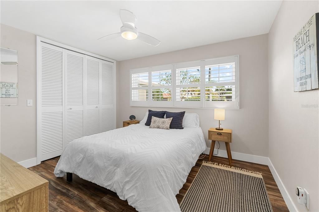 2nd Bedroom with Plantation Shutters and Ample Closet Space.