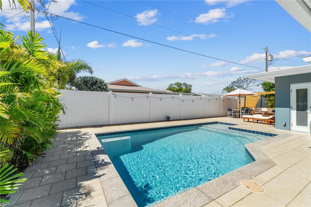 Out to your Shellock Patio and Heated Saltwater Pool.  Enter this low maintenance back yard through 5 different entrances!