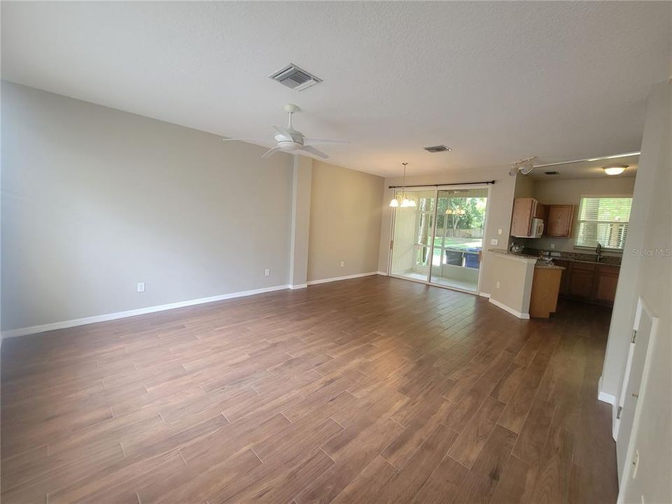 vew of the open concept downstairs living space, the floors are time not wood on the entire forst floor, brand new this week