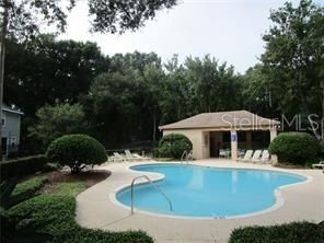 community pool with cabana house.