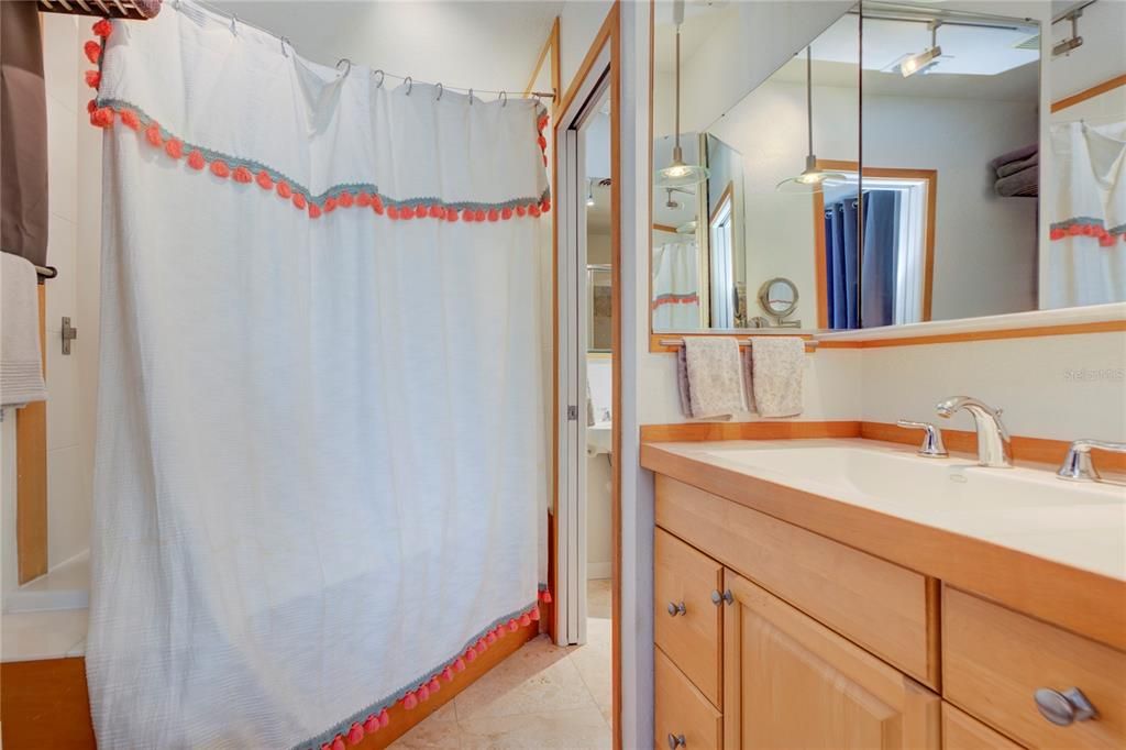 En Suite Bathroom off primary bedroom with jet tub / shower combo