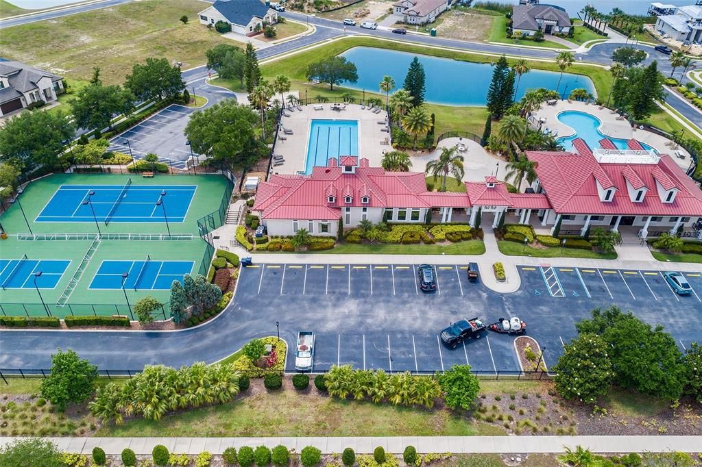 AERIAL OF CLUBHOUSE, POOLS, BALL COURTS