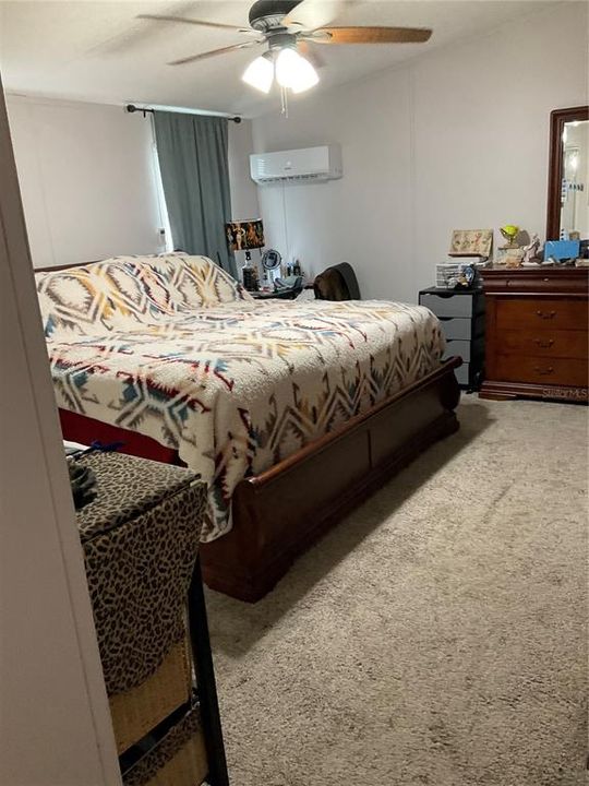 Spacious master bedroom with additional mini split ac for additional comfort