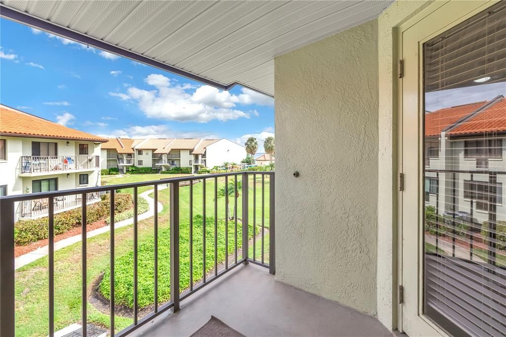 Balcony with side view of waterfront