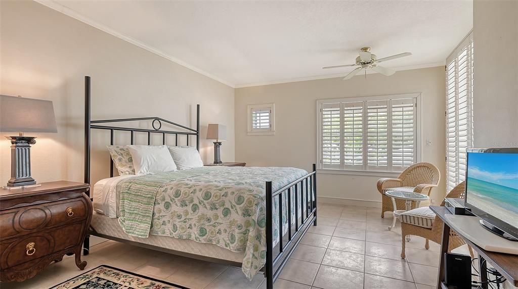 2nd Bedroom with plantation shutters, walk-in closet & access to private lanai