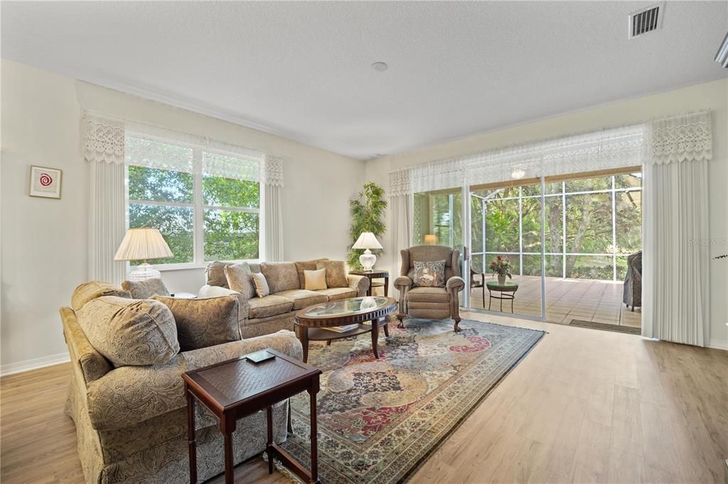 Family Room is spacious and leads out to a triple sliding glass door to the lanai.