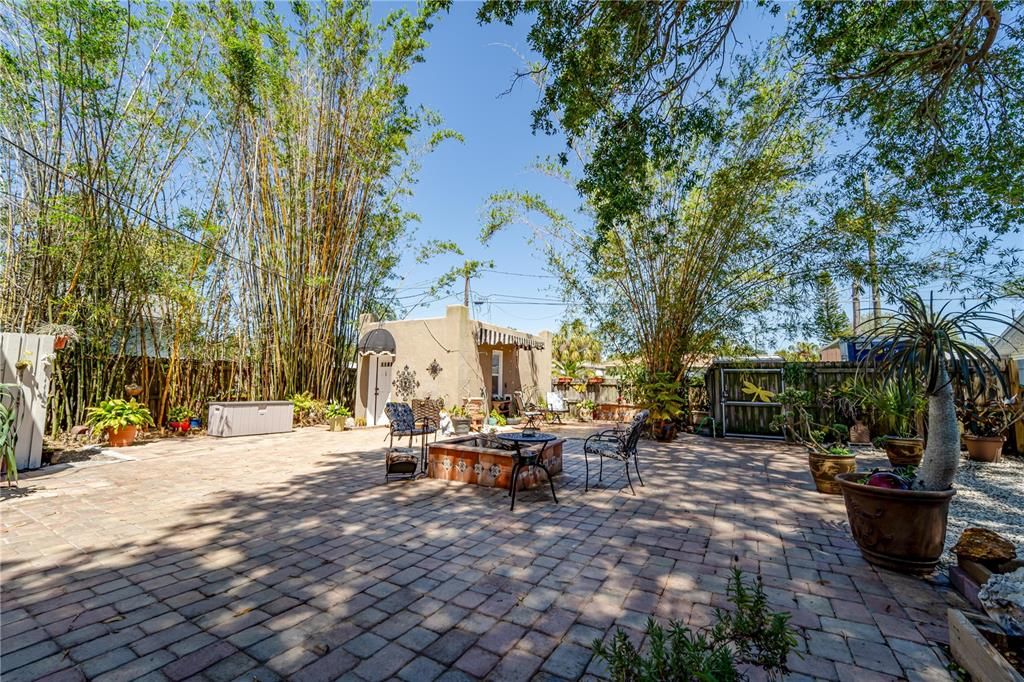 Large backyard with fire pit area