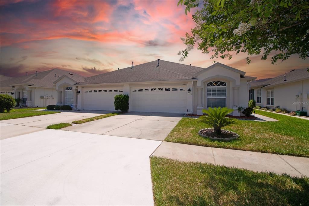 Gorgeous front of house with 2 car garage and driveway