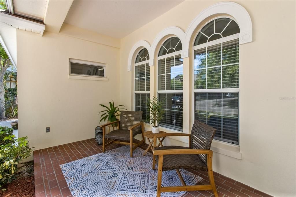 Enjoy catching up with the neighbors while relaxing in the shade of this cozy front porch!