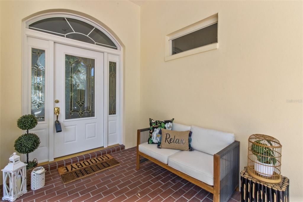 Welcome guests on this inviting covered front porch!