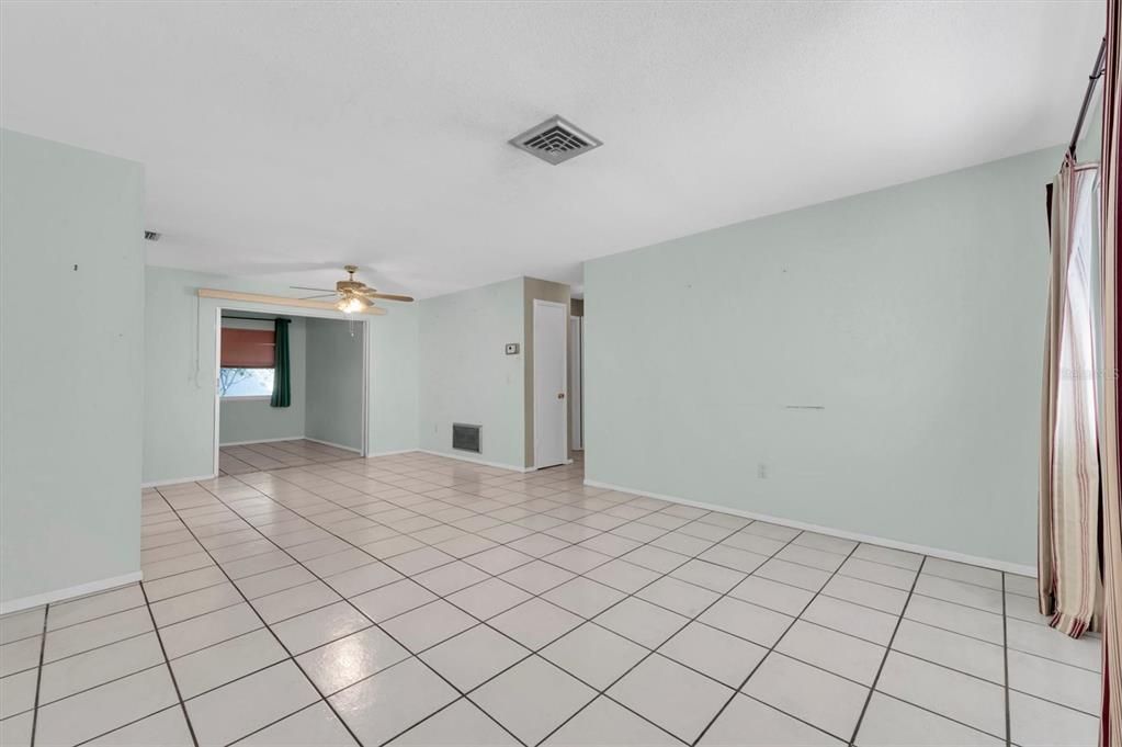 Walk in and have a nice open feel where living and dining space flow into each other. Wide entry is to back bonus area, hallway leads to the two baths and bedrooms