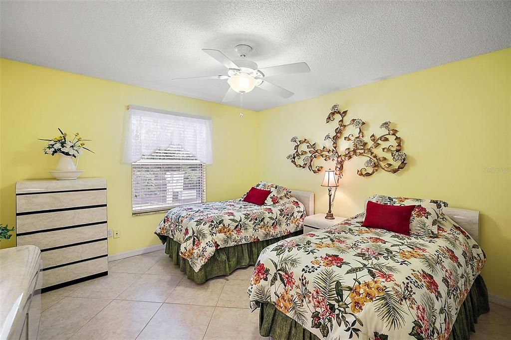 GUEST BEDROOM IS FURNISHED WITH 2 TWIN BEDS AND DRESSER.  OVERLOOKS PRIVATE BACK YARD