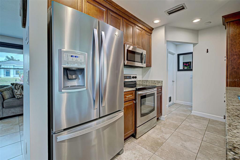 Newer stainless steel appliances, to include a French refrigerator.