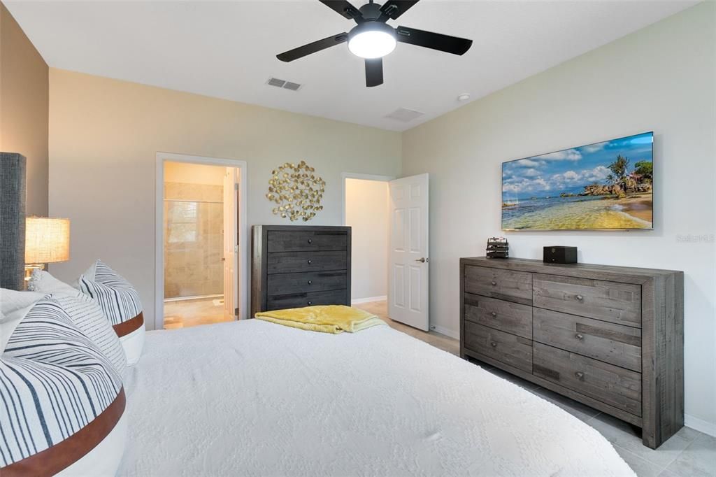 Retreat to your master bedroom at the end of a long day.