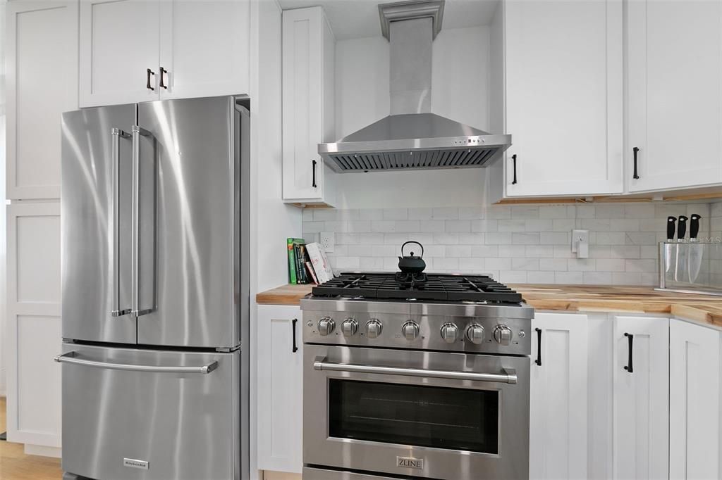 From the modern appliances to the tile backsplash, beautiful touches abound in the kitchen.