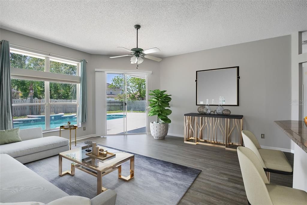 This photo has been virtually staged. Another set of sliding glass doors leading to the outdoor oasis